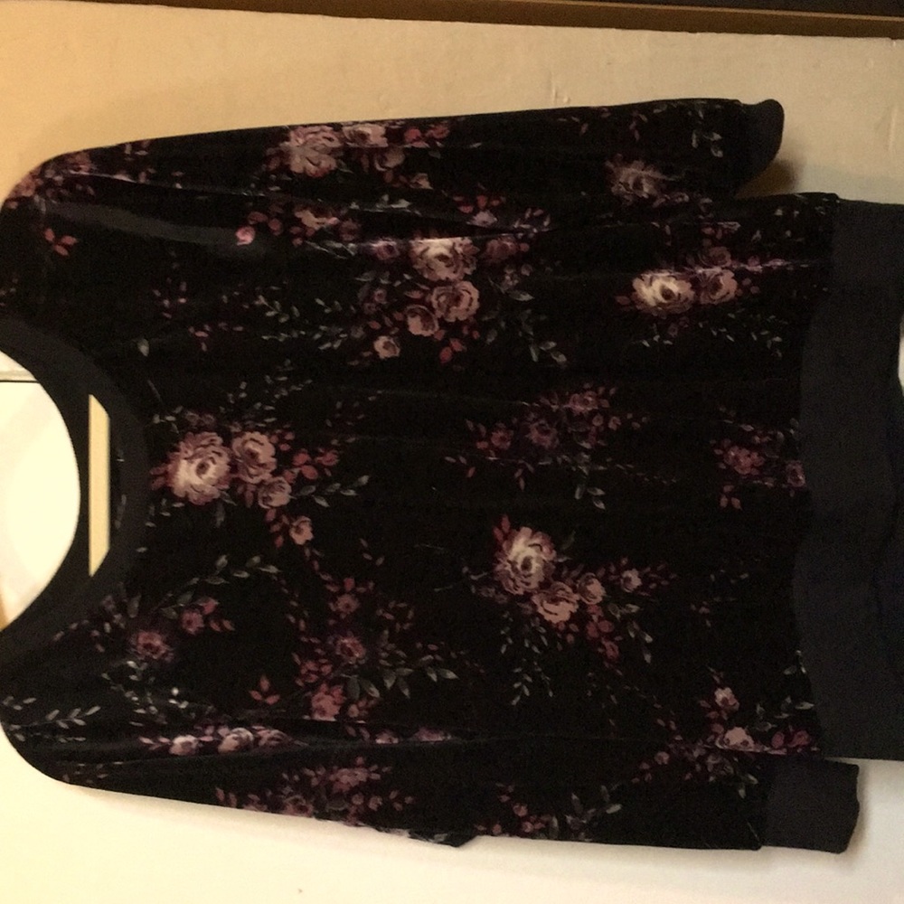 Black sweatshirt with flowers on it and it is soft